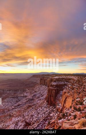 Colorful winter sunrise over Canyonlands National Park with the Abajo Mountains. View rom Buck Canyon Overlook. Stock Photo