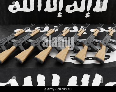 Automatic rifles standing on the table. 3D illustration Stock Photo