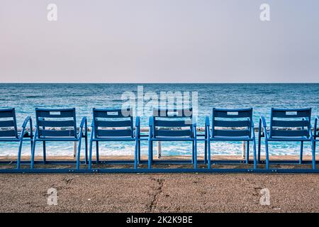 Famous blue chairs on beach of Nice, France Stock Photo