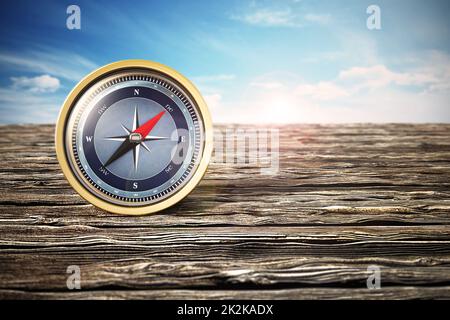 Vintage compass standing on old wood. 3D illustration Stock Photo