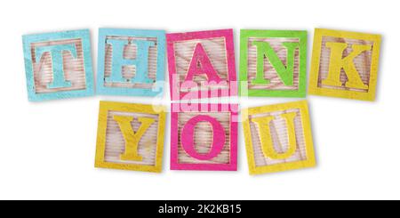 Thank you concept with childs wood blocks on white with clipping path to remove shadow Stock Photo