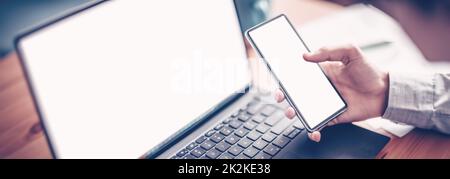 Businessman sitting at the table and using smartphone. Stock Photo