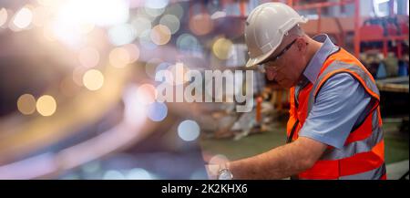 Professional worker pressing buttons on machine control board Stock Photo