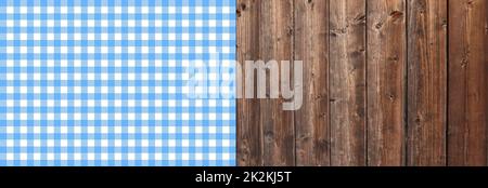 Tablecloth blue and white on brown wooden planks Stock Photo