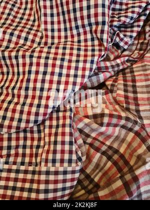 Patterns of similar but different plaid fabrics and with similar colors and shades Stock Photo
