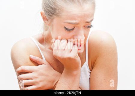 young frightened woman expressing FEAR Stock Photo