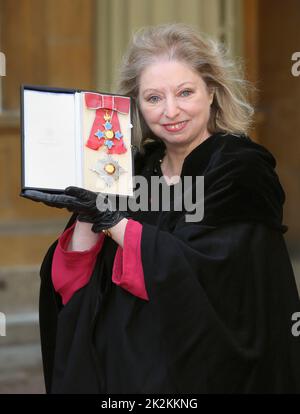 File photo dated 06/02/15 of writer Dame Hilary Mantel holding her Dame Commander of the British Empire medal presented to her for services to literature at an Investiture ceremony at Buckingham Palace in central London. The Wolf Hall writer has died 'suddenly yet peacefully' surrounded by close family and friends aged 70, HarperCollins has announced. Issue date: Friday September 23, 2022. Stock Photo