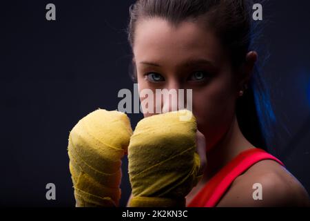 Close-up portrait of woman in boxing hand wraps Stock Photo