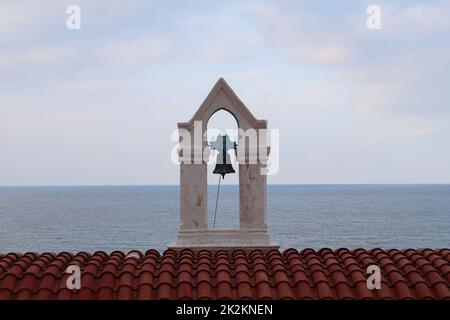 Picturesque bell tower of Agia Kyriake Church in Chania with the sea in the back Stock Photo