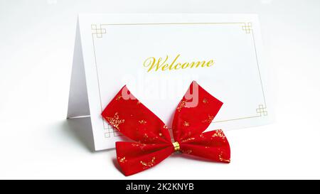 Welcome text on greeting card with bow Stock Photo