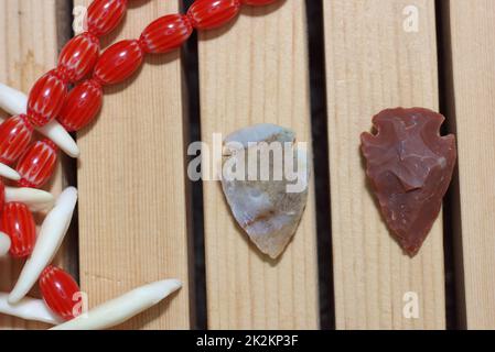 Native American Arrowheads and Beaded Necklace With Coyote Teeth Stock Photo