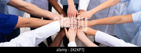 Directly Above Shot Of Medical Team Stacking Hands Together At Hospital Stock Photo