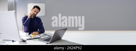 Businessman Suffering From Neck Pain Stock Photo