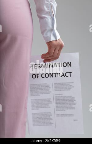 Woman holding a resignation or Termination of Contract letter Stock Photo