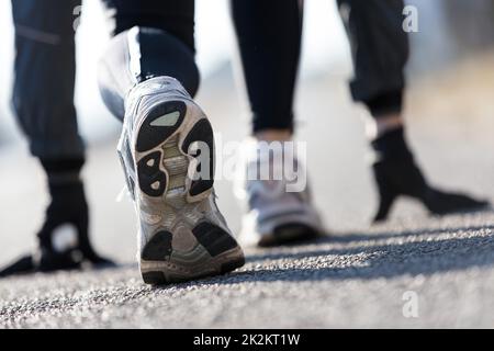 athlete simulating starting blocks on the street Stock Photo