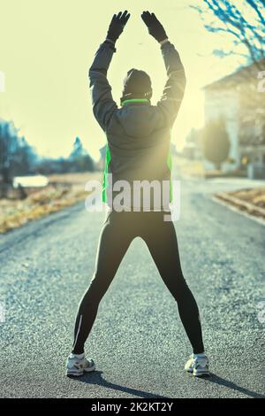 first the warm-up and then the runner will train Stock Photo