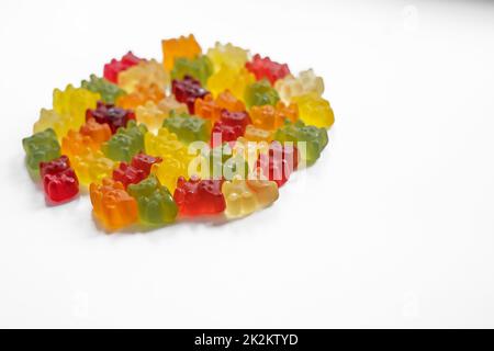 a bunch of colorful gummy bears on a white background Stock Photo