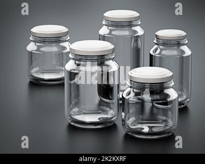 Empty glass jars with white lids isolated on black background. 3D illustration Stock Photo