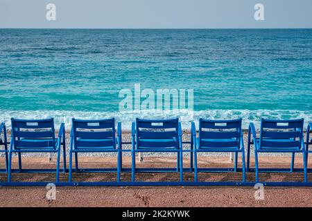 Famous blue chairs on beach of Nice, France Stock Photo