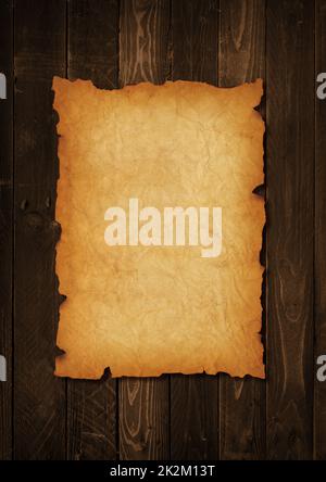 Old mediaeval paper sheet. Parchment scroll on a wood board Stock Photo