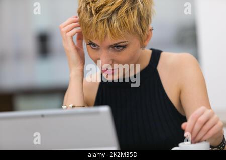 woman in oline dating on a public internet point Stock Photo