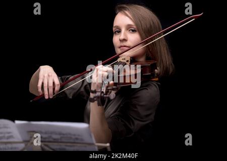 proud violinist woman with her violin and bow Stock Photo