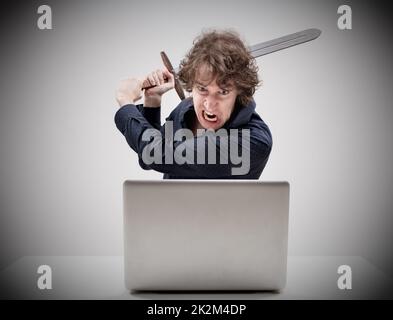 angry man about to destroy his laptop Stock Photo