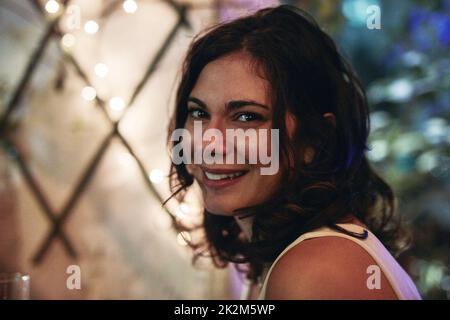 Having a chilled night out. Cropped portrait of an attractive young woman sitting in a club. Stock Photo