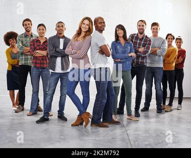 There is more power in unity than division. Studio shot of a diverse group of people standing together. Stock Photo