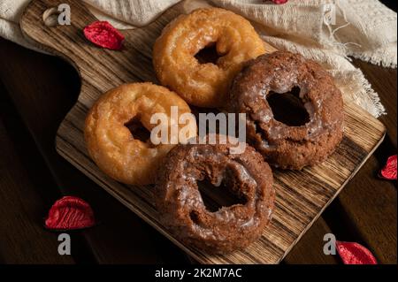 4 japanese donuts on wooden table with dark tone Stock Photo