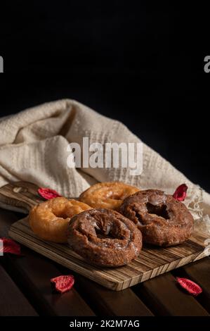 4 japanese donuts on wooden table with dark tone Stock Photo