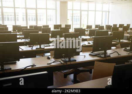 office room of many desktop computers. Stock Photo