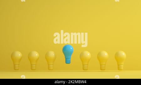 Blue Bulbs among yellow bulbs on yellow background. Leadership, innovation, great idea and individuality concepts. Stock Photo