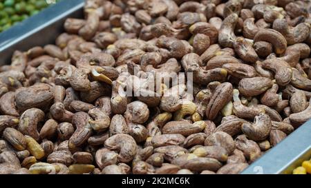 Cashews fried in shell, unsalted cashew nuts for sale in local market Stock Photo