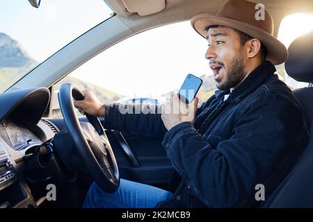 Wherever you get to is better than where you started. Shot of a young man singing in the car. Stock Photo