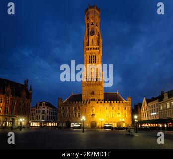 Belfry tower and Grote markt square in Bruges, Belgium on dusk in twilight Stock Photo