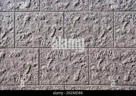 Background from a wall with rectangular grey stone slabs Stock Photo