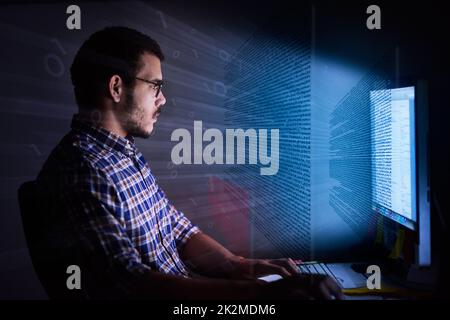 Ready, set, code. Cropped shot of a young computer programmer looking through data. Stock Photo