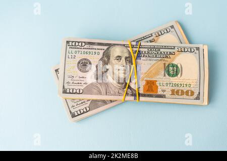 International banknotes - dollars, euros tied with an elastic band. Place for an inscription. The concept of currency transactions, loans, exchange, gambling. Stock Photo