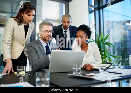 We have so much potential to improve our profits. Cropped shot of a group of business colleagues meeting in the boardroom. Stock Photo