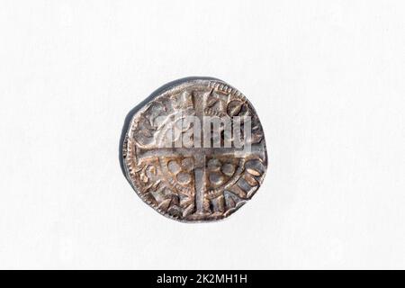 Silver long cross penny English hammered coin of King Henry II of the 14th century dated around 1310- 1314 minted in Canterbury England, reverse cut o Stock Photo