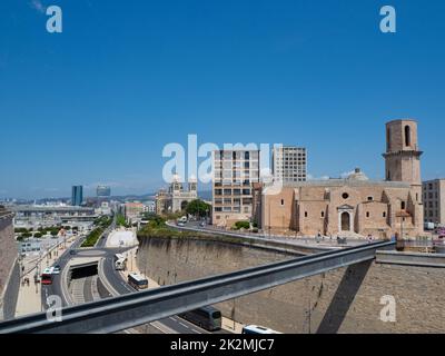 Marseille, France - May 15th 2022: Historic church St-Laurent surrounded by urban infrastructure Stock Photo