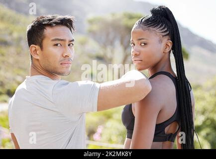 Fitness, challenge and couple ready for exercise, running and workout on a mountain together in nature. Interracial, sports portrait and healthy black Stock Photo
