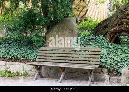 Memorial stone with the inscription: Here Schiller wrote the Wallenstein 1798, bench in the garden of Schiller's summer house Stock Photo