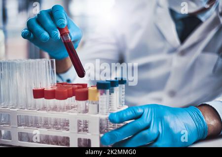 Time for sampling. Cropped shot of an unrecognizable scientist working in a lab. Stock Photo