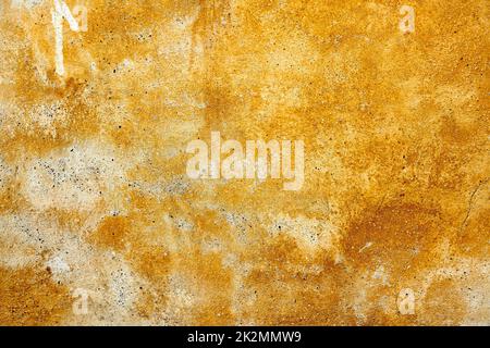 yellow weathered paint on a plastered wall Stock Photo