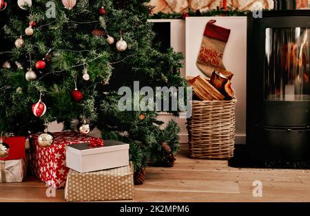 We are stocked up on presents. Cropped shot of a bunch of presents placed under a Christmas tree ready to be opened in the morning. Stock Photo