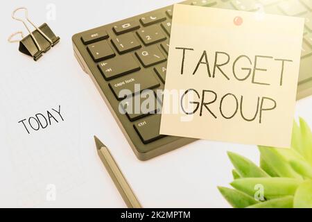 Hand writing sign Target Group. Business idea Particular showing that an advertisement intended to reach to Computer Keyboard And Symbol.Information Medium For Communication. Stock Photo