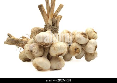 Braided garlic bulbs isolated on white background Stock Photo