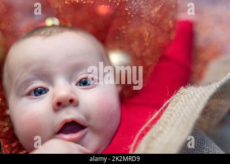 Small baby boy with pretty face in close-up Stock Photo
